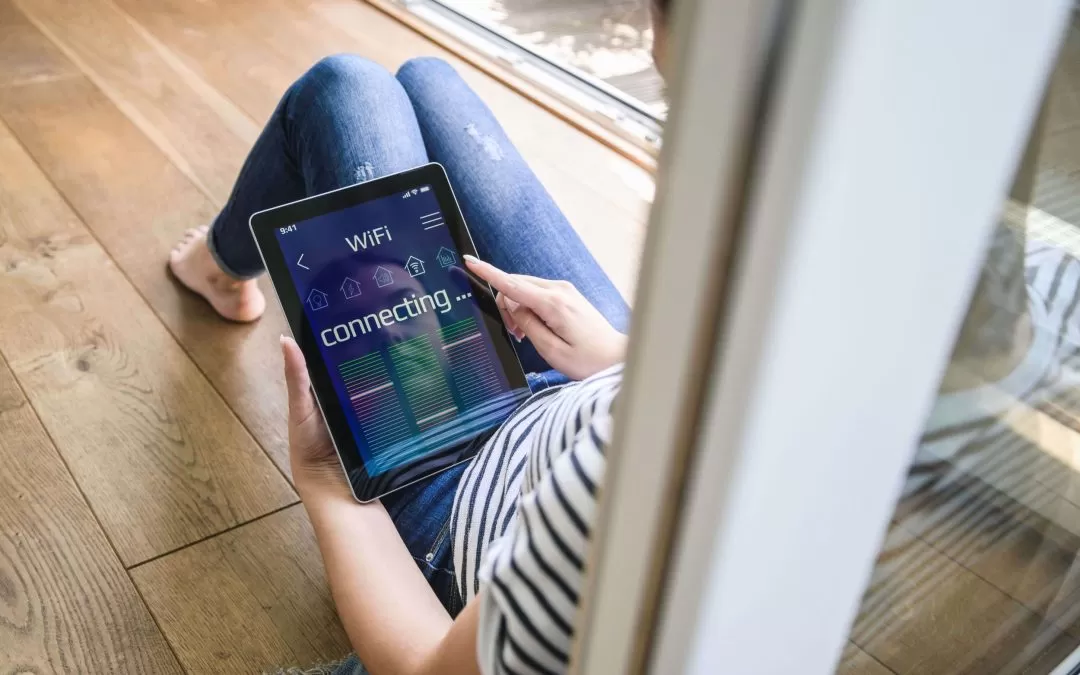 young woman with tablet with smart home control