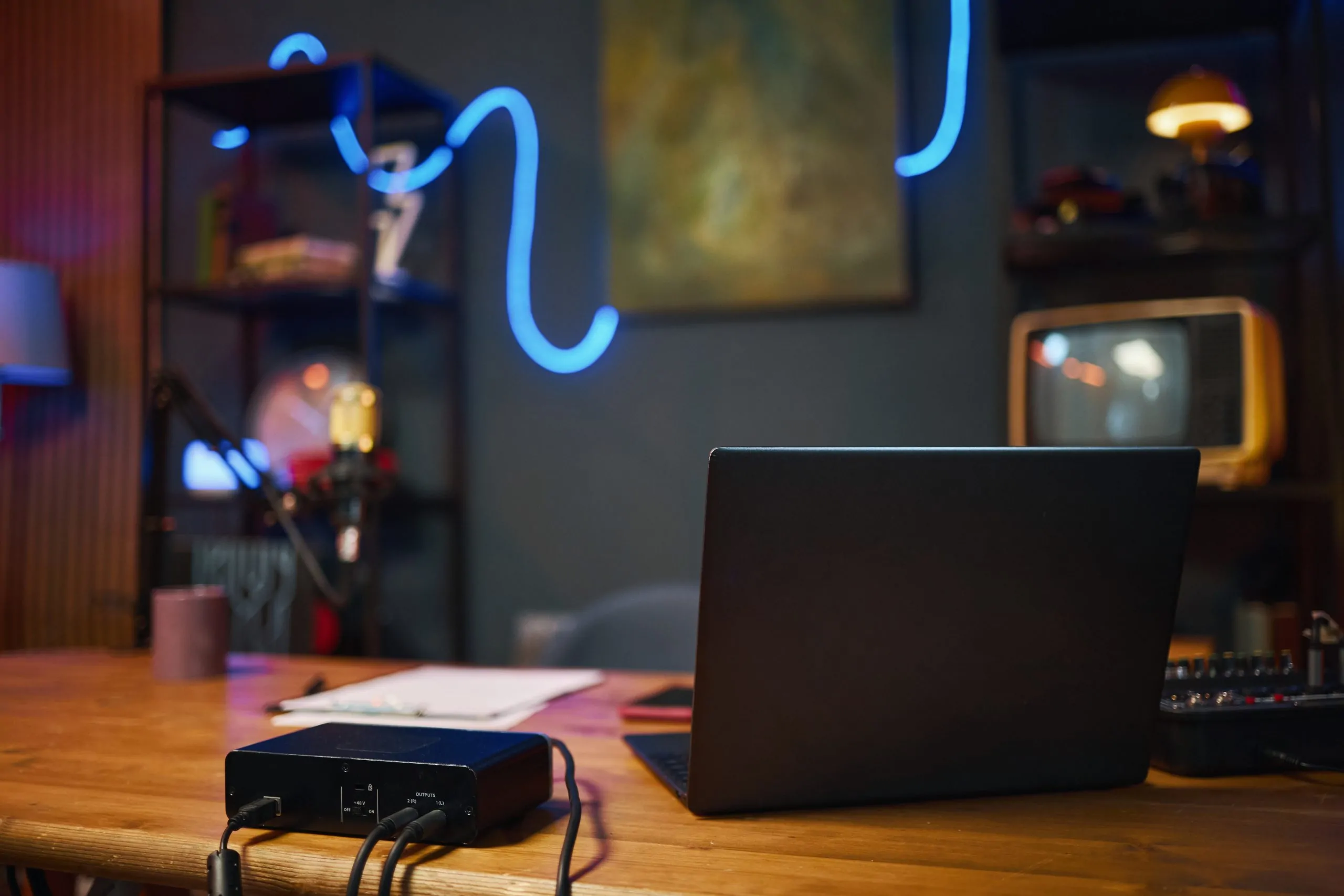 Laptop on table for online work in recording studio