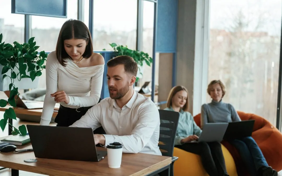 People are working in the office with bean bags chairs in it